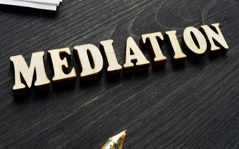 Judge hammer on an old desk on blurred background